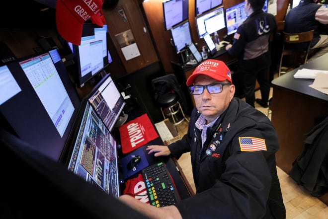 A trader wears a hat in support of Republican Donald Trump, after he won the U.S. presidential election, at the New York Stock Exchange (NYSE) in New York City, Nov. 6, 2024.